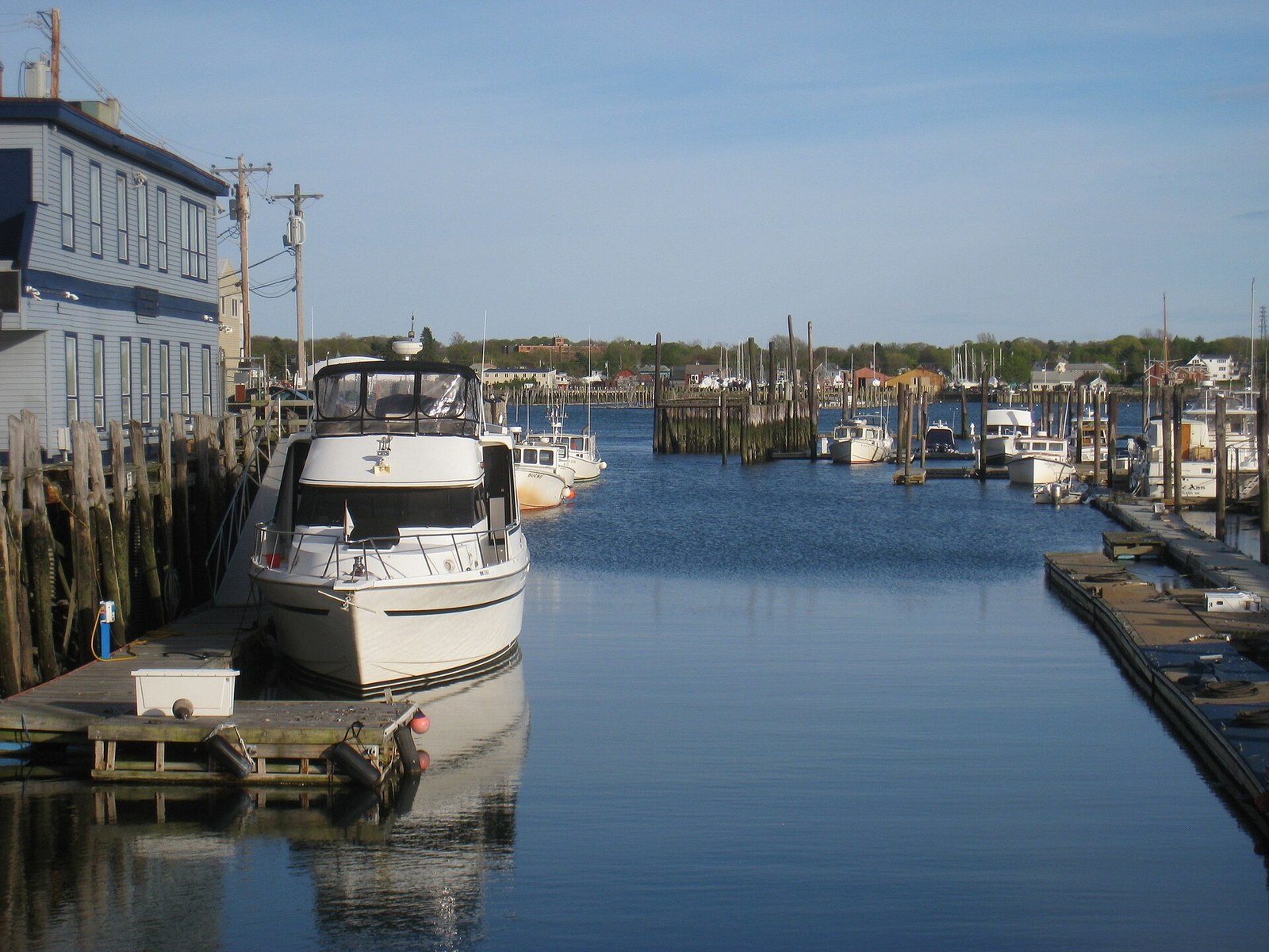 Boats tied along a calm wharf in Portland's Old Port.